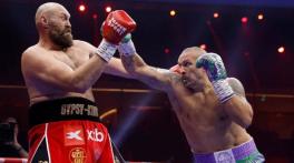 Oleksandr Usyk downs Tyson Fury to retain world heavyweight titles