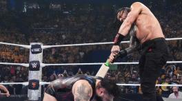 WATCH: Roman Reigns uses cricket bat to attack Reed at WWE Crown Jewel
