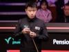 Zhao Xintong opens title defence with win over Liam Highfield at Crucible