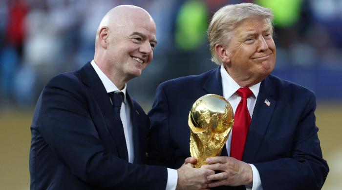 Boos greet Trump and Infantino as they enter field for World Cup trophy ceremony