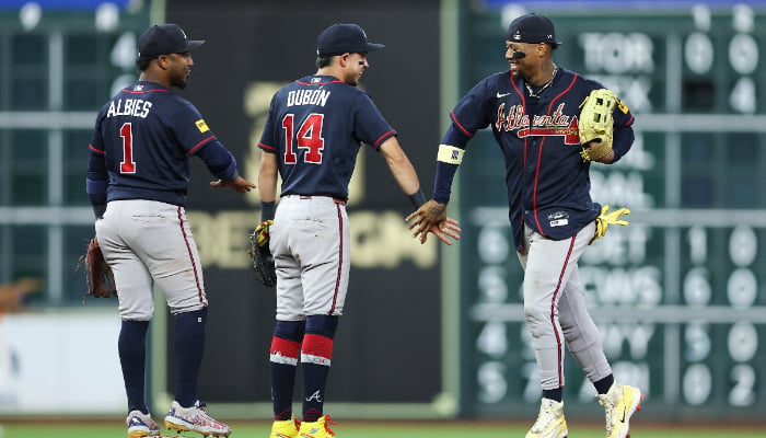 Ronald Acuna Jr and Mauricio Dubon after Atlanta clinched a 2026 postseason berth in Houston